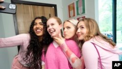 This image released by Paramount Pictures shows, from left, Avantika, Angourie Rice, Renee Rapp and Bebe Wood in a scene from "Mean Girls." (Jojo Whilden/Paramount via AP)
