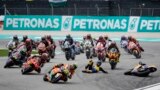 Spain's rider Fermin Aldeguer, foreground, leads as Spains rider Manuel Gonzalez Simon falls during Moto2 class race of the MotoGP Malaysian Grand Prix at the Sepang International Circuit in Sepang, Malaysia, Nov. 12, 2023. 