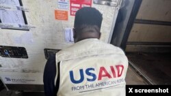 A USAID/Nigeria worker unloads a refrigerated container with mpox vaccines in Abuja, in a photo posted on X by @USAIDNigeria on Aug. 28, 2024.