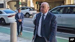 FILE - British tech magnate Mike Lynch walks into federal court in San Francisco, March 26, 2024.