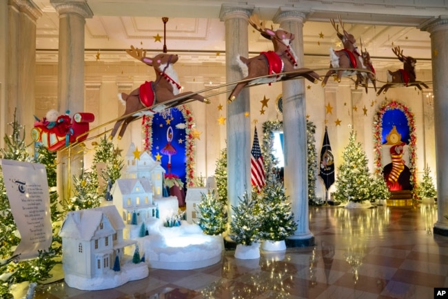 FILE - Holiday decorations adorn the Grand Foyer of the White House for the 2023 theme "Magic, Wonder, and Joy," Monday, Nov. 27, 2023, in Washington. (AP Photo/Evan Vucci)