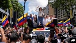 Maria Corina Machado leads a protest against the reelection of President Nicolás Maduro one month after the disputed presidential vote that she claims the opposition won by a landslide, in Caracas, Venezuela, Aug. 28, 2024.