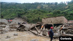 Una avalancha en el municipio de Quetame, Cundinamarca, a pocas horas de Bogotá deja hasta el momento 11 personas muertas y varios desaparecidos. [Foto: cortesía de la Policía de Colombia]