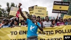 Climate activists chant slogans and hold banners as they march to demand drastic reduction in global plastic production ahead of the third meeting of the Intergovernmental Negotiating Committee (INC-3) in Nairobi, Kenya on Saturday November 11, 2023. 