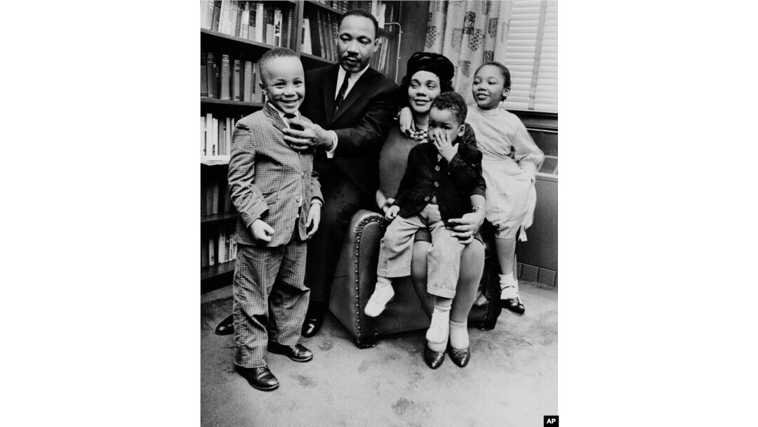 The family of Martin Luther King Jr. and Coretta Scott King at their Atlanta home in 1963. Dexter King, age 2, sits on his mother's lap. Also pictured are Martin III, age 5, and Yolanda, 7.