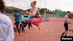 FILE - Spanish Paralympic athlete Adiaratou Iglesias, 25, warms up before the International Para Athletics Meeting, ahead of the Paris 2024 Paralympic Games, in L'Hospitalet de Llobregat, near Barcelona, Spain, April 27, 2024.