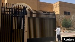 FILE - People stand outside the Iranian embassy in Riyadh, Saudi Arabia, April 12, 2023. Saudi Arabia broke ties with Iran in 2016, but Iran announced on June 5, 2023, that the embassy and other diplomatic offices will reopen. 