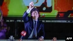 FILE - Javier Milei celebrates with supporters after winning Argentina's presidential election runoff outside his party headquarters in Buenos Aires, Nov. 19, 2023.