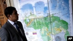 FILE - Venezuela's new map that includes the Essequibo territory as its own is displayed at the Foreign Ministry in Caracas, Venezuela, Dec. 11, 2023.