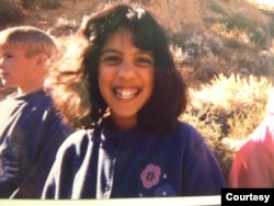 Tawheeda Wahabzada smiles as a child in Carson City, Nevada, where her family moved because they had relatives there. (Photo courtesy of Tawheeda Wahabzada)