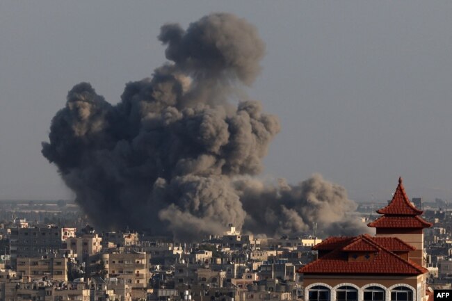 A picture taken from Rafah shows smoke billowing over Khan Younis in the southern Gaza Strip during Israeli bombardment on Jan. 24, 2024.