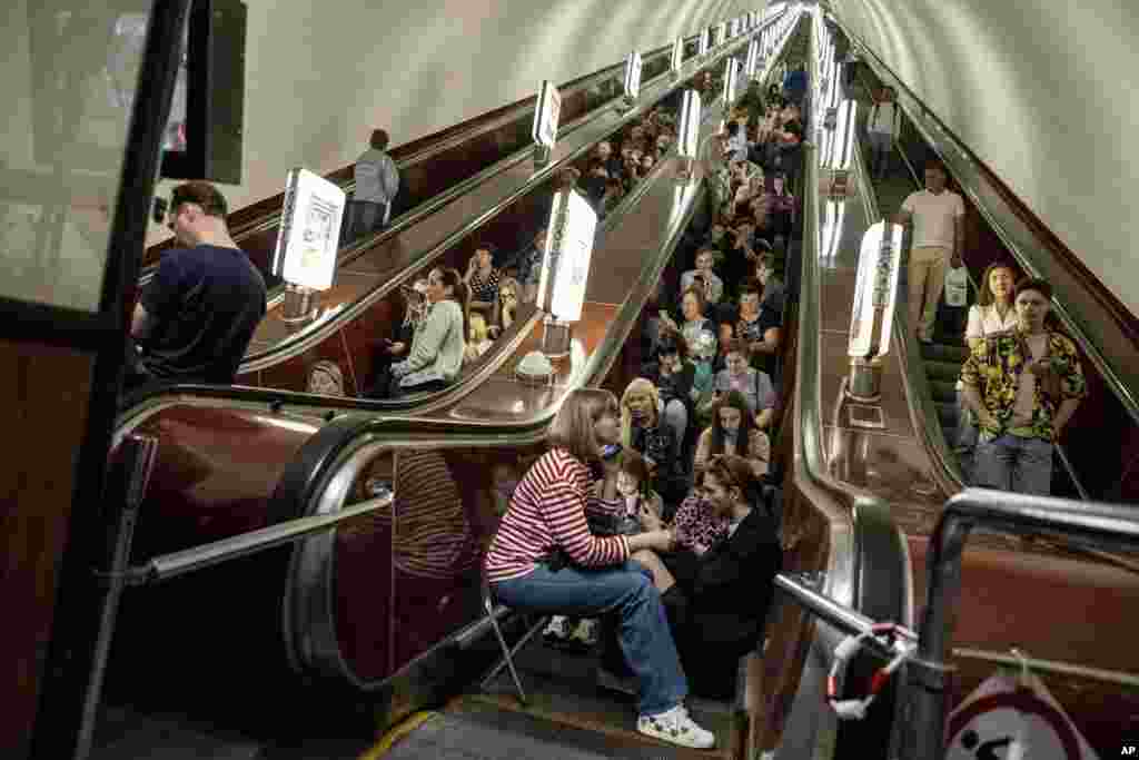 People take cover at metro station during a Russian rocket attack in Kyiv, Ukraine.