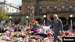 Britain&#39;s King Charles makes a community visit, following a mass stabbing that led to riots and racist attacks targeting Muslims and migrants, outside the Town Hall in Southport.