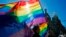 FILE — Gay rights activists carry rainbow flags as they march during a May Day rally in St. Petersburg, Russia, May 1, 2013. Russia’s Supreme Court on Nov. 30, 2023, effectively outlawed LGBTQ+ activism in the increasingly conservative country. 