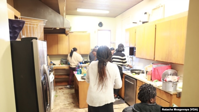 Asylum-seekers from Africa cook at the small church kitchen in Riverton Park United Methodist Church in Tukwila, Washington.
