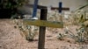 FILE - Wooden crosses made with the remains of boats used by migrants to cross the Mediterranean sea are seen in the cemetery where victims of shipwrecks are buried, on the island of Lampedusa, Italy, on Sept. 25, 2023.