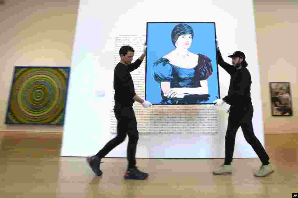 Art handlers carry an Andy Warhol portrait of Princess Diana created in 1982, as it is displayed at Phillips auction rooms in London.&nbsp;The painting will be auctioned estimated at 1,200,00 - 1,800,00 UK Pounds ($1,520,000 - 2,280,000) in the London 20th Century and Contemporary Art Sales on March 7 and 8.&nbsp;