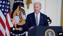 FILE - President Joe Biden delivers remarks about government regulations on artificial intelligence systems during an event in the East Room of the White House, Oct. 30, 2023, in Washington.