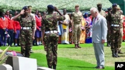 Britain's King Charles III prepares to lay a wreath, during a visit to Kariokor World War II Commonwealth Cemetery in Nairobi, Kenya, Nov. 1, 2023, in honor of Kenyans who fought alongside the British in the two world wars.