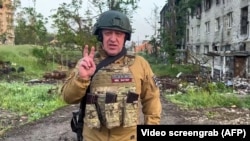 FILE - This video grab taken from handout footage posted May 25, 2023, on the Telegram account of the press service of Concord - a company linked to Russian mercenary Wagner group, shows Yevgeny Prigozhin speaking from Bakhmut. 