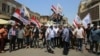 Iraqis Protest Dinar Deterioration After US Ban on Iraqi Banks 