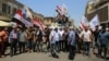 Demonstrators protest in front of the Iraqi central bank as currency plummets against the US dollar, in Baghdad, Iraq, July 26, 2023. 