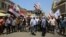 Demonstrators protest in front of the Iraqi central bank as currency plummets against the US dollar, in Baghdad, Iraq, July 26, 2023. 