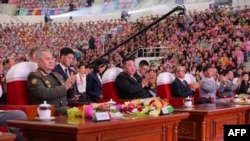 North Korean leader Kim Jong Un (C), Chinese Communist Party politburo member Li Hongzhong (4th R) and Russian Defense Minister Sergei Shoigu (L) attend a war anniversary event in Pyongyang, July 27, 2023. (Korean Central News Agency)