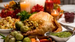 FILE - A grill-roasted brined turkey is presented on a table in Concord, New Hampshire.