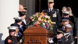 An Armed Forces body bearer team carries the casket of former first lady Rosalynn Carter after a tribute service at Glenn Memorial Church at Emory University, in Atlanta, Nov. 28, 2023.
