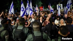 Protesters gather near the residence of Israeli Prime Minister Benjamin Netanyahu in Jerusalem as the conflict between Israel and Palestinian Islamist group Hamas continues, Nov. 4, 2023.