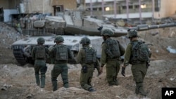 FILE — Israeli soldiers participate in a ground operation in the Gaza Strip, Nov. 8, 2023. Israel Prime Minister Benjamin Netanyahu said the Palestinian Authority will not govern Gaza after the war. 