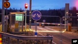 A fence is seen at the closed-off Nuijamaa border crossing between Russia and Finland, in Lappeenranta, Finland, Nov. 18, 2023.