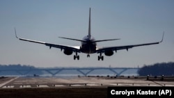 FILE - A Southwest plane lands at Ronald Reagan Washington National Airport in Arlington, Va., Dec. 30, 2022. (AP Photo/Carolyn Kaster, File)