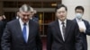 Russia's deputy foreign minister Andrey Rudenko, left, and China's Foreign Minister Qin Gang walk together as they meet in Beijing, June 25, 2023.