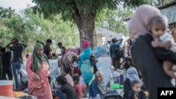 FILE - Refugees from Sudan who crossed into Ethiopia take shelter in Metema, on May 5, 2023. 