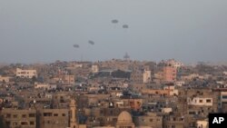 Humanitarian aid is dropped by the United States over Gaza City, Gaza Strip, March 2, 2024.