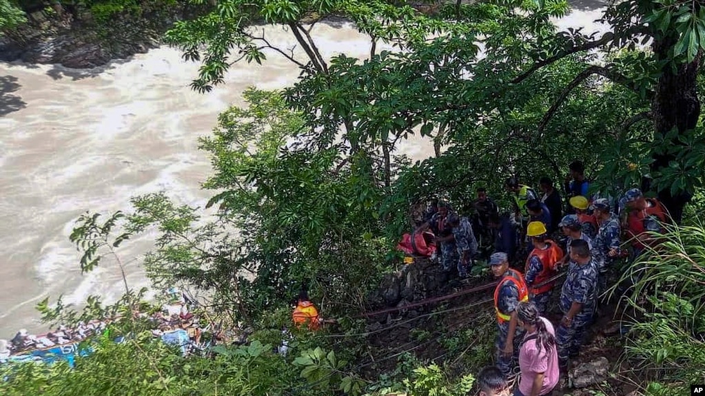 Nepal Armed Police Force are seen carrying out rescue operation after a bus transporting Indian pilgrims fell into a river near Abukhaireni town, about 75 miles west of Kathmandu, Aug. 23, 2024. (Nepal Armed Police Force via AP)