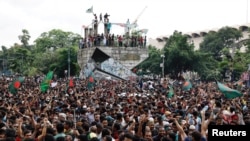 People celebrate the resignation of Bangladeshi Prime Minister Sheikh Hasina in Dhaka, Aug. 5, 2024.