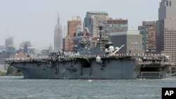 FILE - The USS Bataan,.from Norfolk, Va., sails up the Hudson River in New York, May 25, 2016. The three-ship Bataan amphibious readiness group is being sent to the Persian Gulf in the wake of Iranian attempts to seize commercial ships there. 