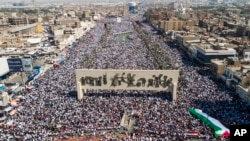 Iraqis hold a mass rally supporting the Palestinians in the Gaza Strip, Oct. 13, 2023, in Baghdad, Iraq.