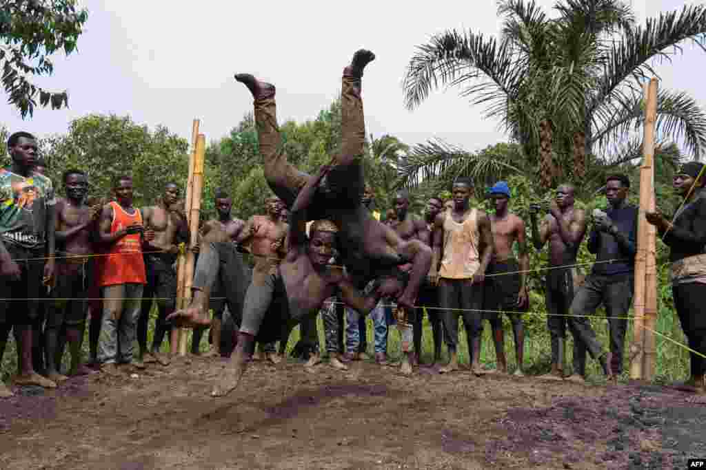 Members of Uganda's Soft Ground Wrestling battle during a training session at their camp in Mukono, Feb. 28, 2024.