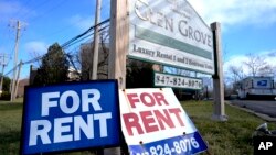 "For Rent" signs are displayed outside a development in Glenview, Ill., Jan. 29, 2024. On Thursday, Feb. 20, 2024, the Commerce Department issues its January report on consumer spending.