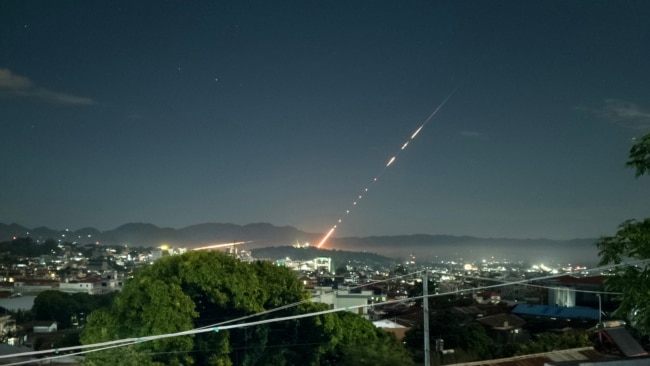 This long exposure picture taken late on Oct. 28, 2023 shows a missile fired from a Myanmar military base in Lashio township, northern Shan State. Heavy fighting between rebels and the military stretched into a second day near the northern border with China, armed groups said.