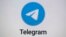 FILE - The logo for the Telegram messaging app is seen on a notebook screen in Munich, Oct. 17, 2022.