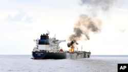 FILE - The tanker Marlin Luanda is seen on fire in the Gulf of Aden after being hit by a missile launched by Yemen’s Houthi rebels, Jan. 27, 2024. A Houthi missile hit the bulk carrier True Confidence in the gulf March 6, killing two. (Indian navy/AP)