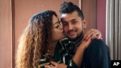 FILE- Same-sex couple Surendra Pandey and Maya Gurung pose for a photograph during an interview with AP in Kathmandu, June 29, 2023. The gay couple just became the first in the nation to receive official same-sex marriage status.