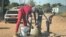 Residents of Sizinda, urban Bulawayo, Zimbabwe, fetching water from a borehole.