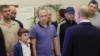 FILE - A man identified as Pablo Gonzalez (2nd-L with beard) listens as Russian President Vladimir Putin, right, speaks to released prisoners upon their arrival as part of an exchange, at Vnukovo airport outside Moscow, Russia, Aug. 1, 2024. (Gavriil Grigorov, Sputnik, via AP)