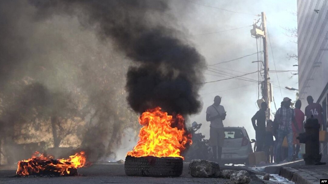 This screen grab taken from AFPTV shows tires on fire near the main prison in Port-au-Prince, Haiti, March 3, 2024, after several thousand inmates broke out of the facility.